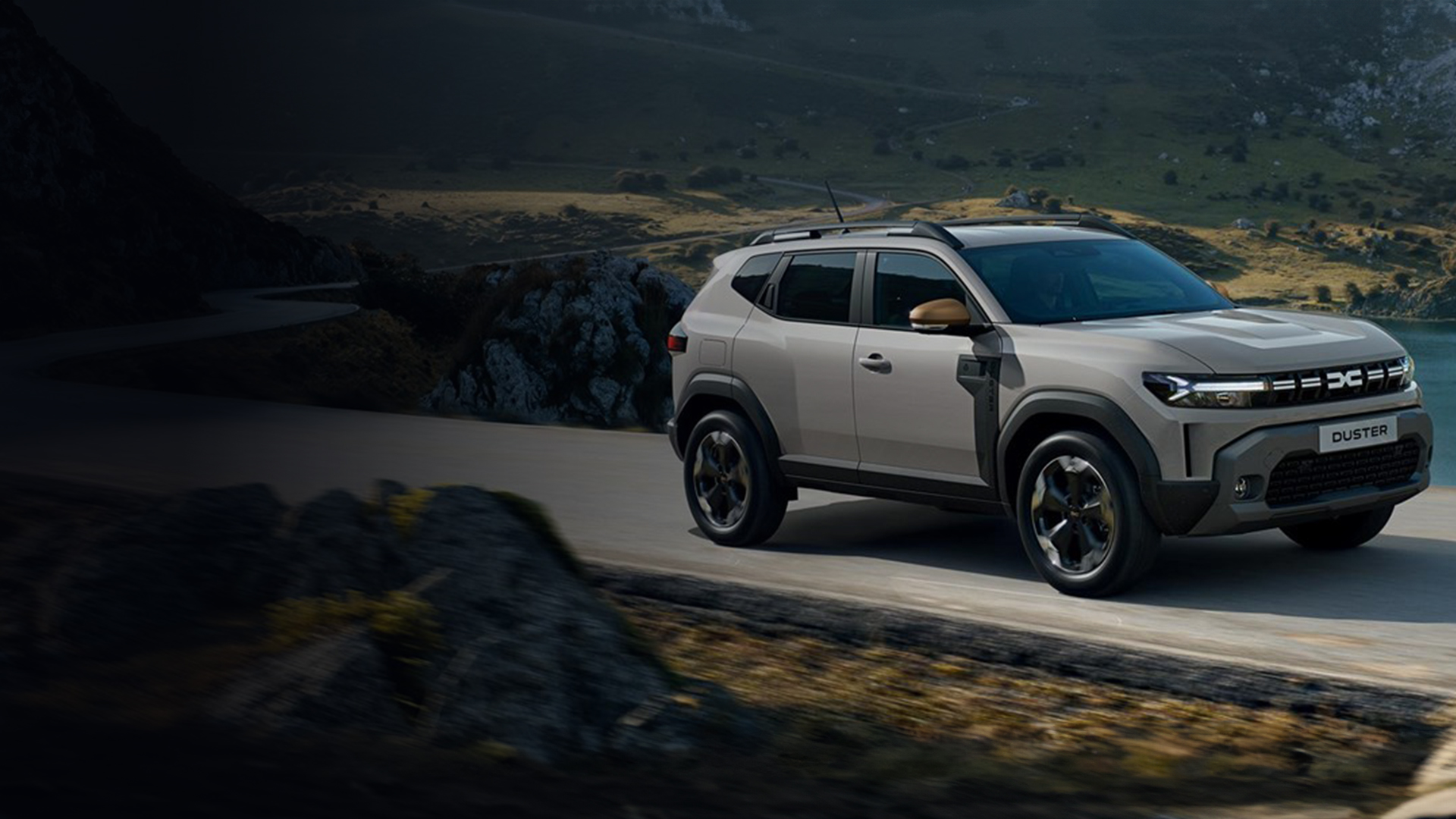 silver renault SUV car with black and gold details in a road