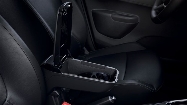 Open armrest storage compartment in a car interior